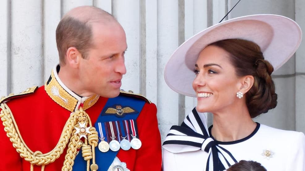 Prince William and Catherine, Princess of Wales smiling together at a royal event, showcasing their strong bond and royal elegance