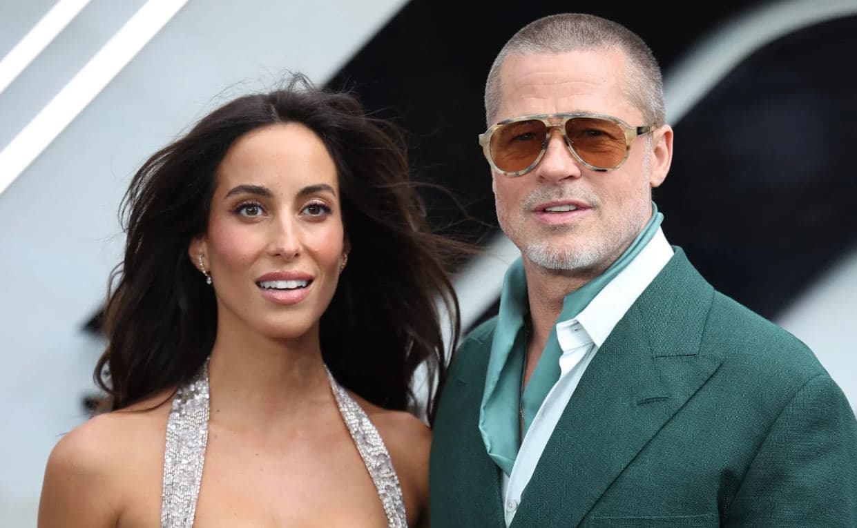 Brad Pitt and Ines de Ramon posing together at a public event during a rare appearance amid growing media attention.