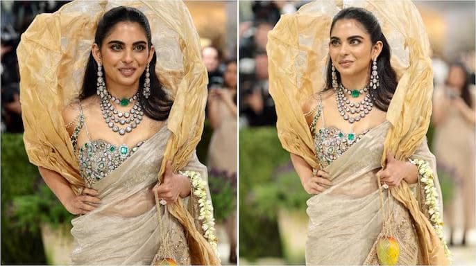 Isha Ambani in a gold saree with statement diamond jewellery, sculptural gajra, and mango accessory at Met Gala 2026 red carpet