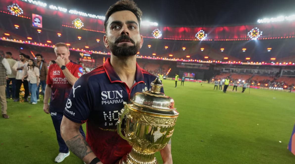 Virat Kohli holds the IPL trophy after leading Royal Challengers Bengaluru to a historic IPL championship victory